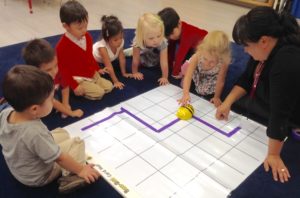 Stratford School preschool students practice coding their Beebot